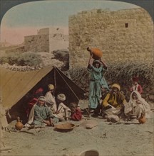 There's no place like home! - dwelling and shop of a Gypsy Blacksmith, Syria, 1900. Artists: Elmer Underwood, Bert Elias Underwood.