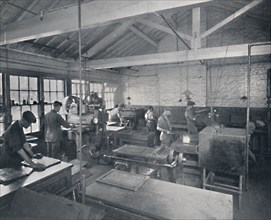 'At Work in the Foundry. Making Wax Moulds of the Pages', 1917. Artist: Unknown.