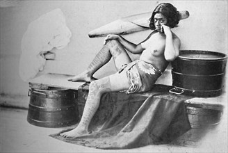 A Marquesa woman with the lower part of the legs fully tattooed, 1902. Artist: Unknown.