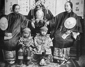 A family group of a prosperous Chinese merchant, 1902. Artist: CC Pierce & Co.