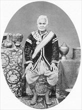 A Lao chief, 77 years old, In Siamese uniform, 1902. Artist: James McCarthy.