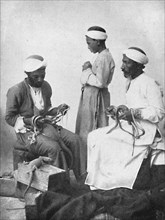 Persian snake charmers, 1902. Artist: W Rau.