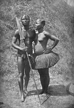 A Mulolo (Congo) warrior and his wife from the central Congo regions, 1902. Artist: Unknown.