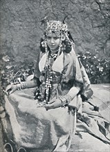 An Algerian woman in gala costume, 1912. Artist: Neurdein freres.