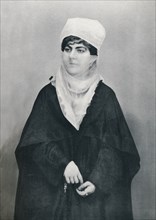 A Turkish lady in outdoor costume, 1912. Artist: Unknown.
