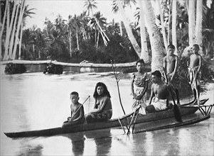 A Samoan canoe with outrigger, and its occupants, 1902. Artist: Kerry & Co.