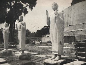 'Steinstatuen vor der in Wiederherstellung befindlichen Ruwanwali-Dagoba, Anuradhapura', 1926. Artist: Unknown.