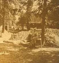 Soldier outside trench, Bois des Loges, northern France, c1914-c1918. Artist: Unknown.
