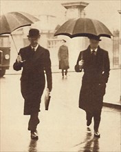 'Walking In The Rain', 1937. Artist: Unknown.