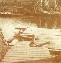 Post on the riverbank, Diksmuide, Belgium c1914-c1918. Artist: Unknown.