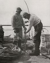 'Dr. Wilson and Dr. Atkinson Loading The Harpoon Gun', c1910?1913, (1913). Artist: Herbert Ponting.