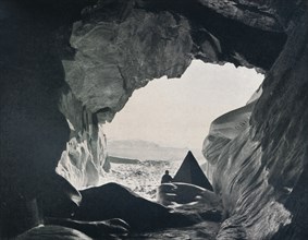 'Camp in the Cave Under Penelope Point', 1912, (1913). Artist: G Murray Levick.