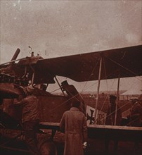 Checking aircraft with the pilot, 1916. Artist: Unknown.