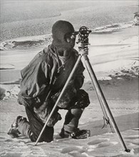 'Lieut. E. R. G. R. Evans Surveying With The Four-Inch Theodolite', October 1911, (1913).  Artist: Herbert Ponting.