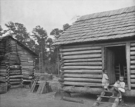 'Negro Log Huts', Thomasville, Georgia, USA, c1900. Creator: Unknown.