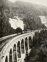 'In the Semmering Valley, Austria. A good train crossing the curved Gamperl Viaduct', 1935-36. Creator: Unknown.