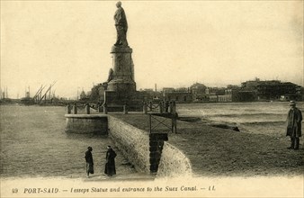 'Port Said. - Lesseps Statue and entrance to the Suez Canal - LL.', c1918-c1939. Creator: Unknown.
