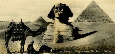 'Cairo - Prayer near the Great Sphinx', c1918-c1939. Creator: Unknown.