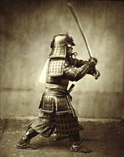 Samurai with raised sword, c1860. Artist: Felice Beato