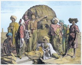 Archaeologist Bernardino Drovetti measuring a colossal head in the Egyptian desert, 1819. Artist: G Engelmann