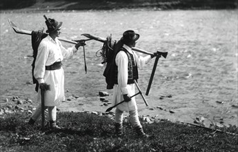 Foresters carrying their tools, Bistrita Valley, Moldavia, north-east Romania, c1920-c1945. Artist: Adolph Chevalier
