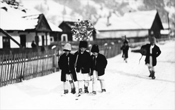 Children walking in the snow, Bistrita Valley, Moldavia, north-east Romania, c1920-c1945. Artist: Adolph Chevalier