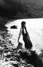 Young woman by a river, Bistrita Valley, Moldavia, north-east Romania, c1920-c1945. Artist: Adolph Chevalier