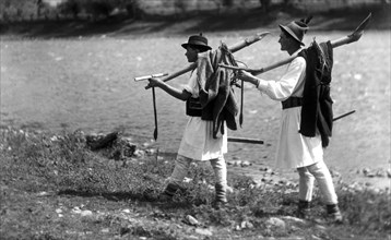 Foresters carrying their tools, Bistrita Valley, Moldavia, north-east Romania, c1920-c1945. Artist: Adolph Chevalier