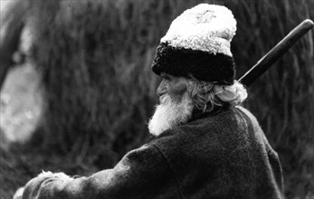 Old man wearing a woolly hat, Bistrita Valley, Moldavia, north-east Romania, c1920-c1945. Artist: Adolph Chevalier