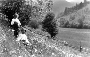 Two girls in a meadow, Bistrita Valley, Moldavia, north-east Romania, c1920-c1945. Artist: Adolph Chevalier