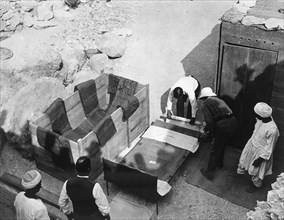 Archaeologists working  at the Tomb of Tutankhamun, Valley of the Kings, Egypt, 1922. Artist: Harry Burton