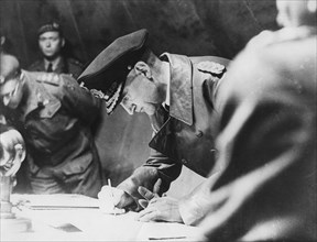 Rear-Admiral Gerhard Wagner signing the German surrender document ending World War II, 1945. Artist: Unknown