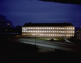 Exterior of an engineering industry building at night, Jönköping, Sweden, 1954. Artist: Göran Algård