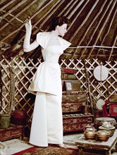 Model showing an evening dress in oriental style, 1950s.  Artist: Göran Algård