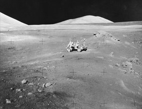 Lunarscape of Station 4, showing Harrison Schmitt at the lunar roving vehicle, 1972.  Creator: Unknown.