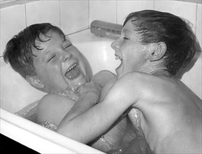 Two boys playing in the bath, Horley, Surrey, c1960-1979(?).