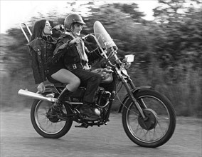 Teenagers on a motobike, Charlwood, Surrey, 1972.