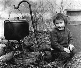 Daphne, gipsy girl, with cooking pot, Charlwood, Surrey, 1964.