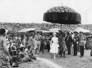 Queen Elizabeth II and the Duke of Edinburgh walking among Ashanti Chiefs, Ghana, 1961. Artist: Unknown