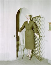 Female model shows a suit, the Historical Museum, Stockholm, 1950s. Artist: Göran Algård