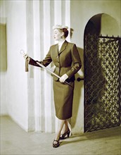 Female model shows a dress, the Historical Museum, Stockholm, 1950s. Artist: Göran Algård
