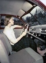 A woman in a Saab 92 car, Sweden, 1952-1953. Artist: Göran Algård