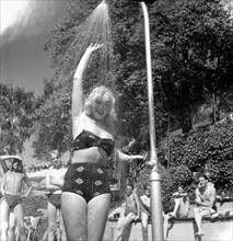 A refreshing shower during the heatwave in Stockholm, Sweden, 24th July 1943. Artist: Karl Sandels