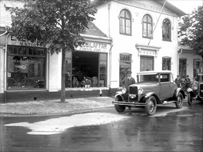 Ford car and driver outside a car company, Landskrona, Sweden, 1925. Artist: Unknown