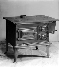 Wood burning stove, manufactured by Landskrona Foundry, Sweden, 1900. Artist: Unknown