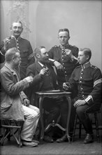 Five men drinking in the photographer's studio, Landskrona, Sweden, 1910. Artist: Unknown
