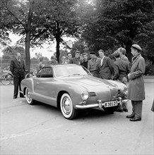 Young men admire the new Volkswagen Karmann Ghia, Landskrona, Sweden, 1955. Artist: Unknown