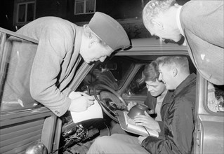 Studying the map in a car rally, Landskrona Motor Club, Sweden, 1965. Artist: Unknown
