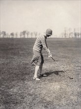 A lady golfer playing at Falsterbo Colf Club, Sweden. Artist: Otto Ohm