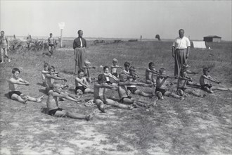 Boys doing exercises before having a swimming lesson, Sweden, 1939. Artist: Otto Ohm